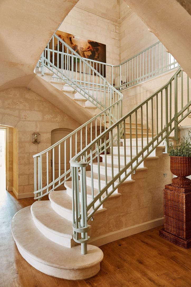 The stone staircase with its pale green balustrade