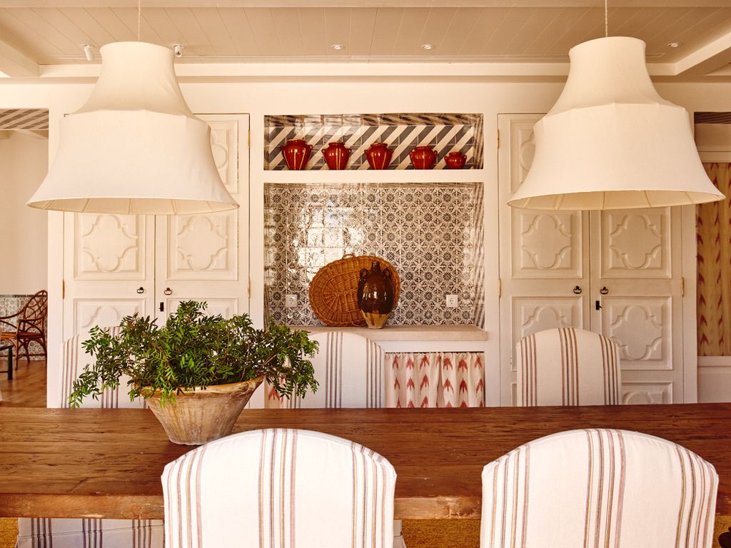 Tiled alcove and painted cupboards in the dining room