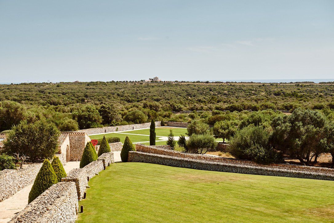 Walled lawns and countryside beyond the estate